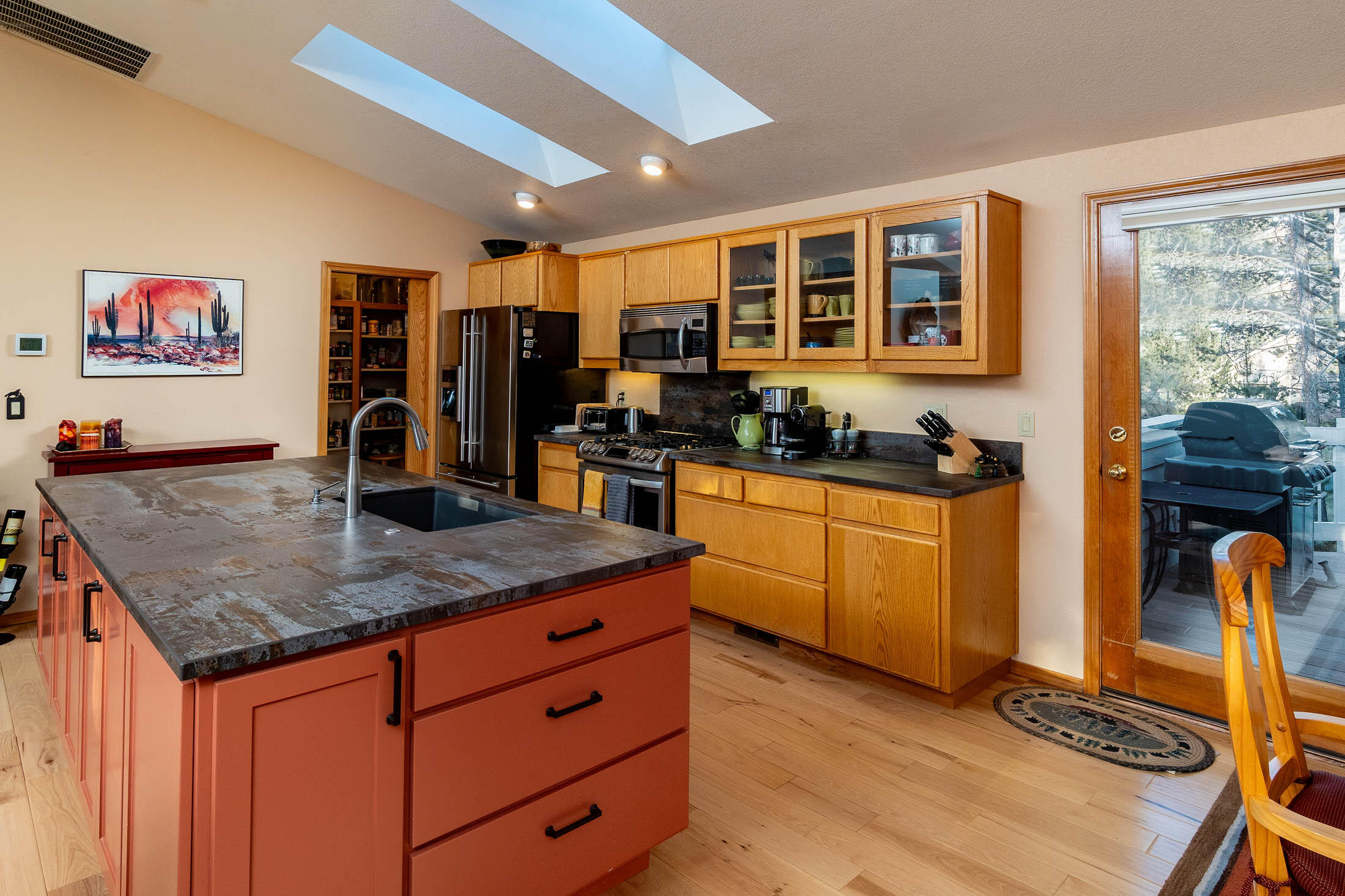 18203 Oregon Loop, Unit 45 Sunriver, OR 97707 - Photo 8 of 33 a kitchen with stainless steel appliances granite countertop a stove a sink and a refrigerator