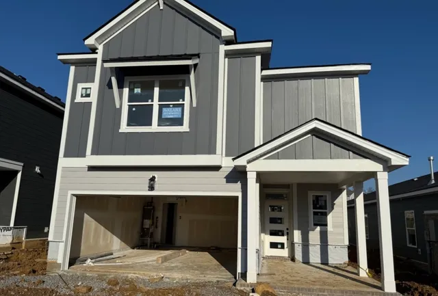 a front view of a house with glass windows