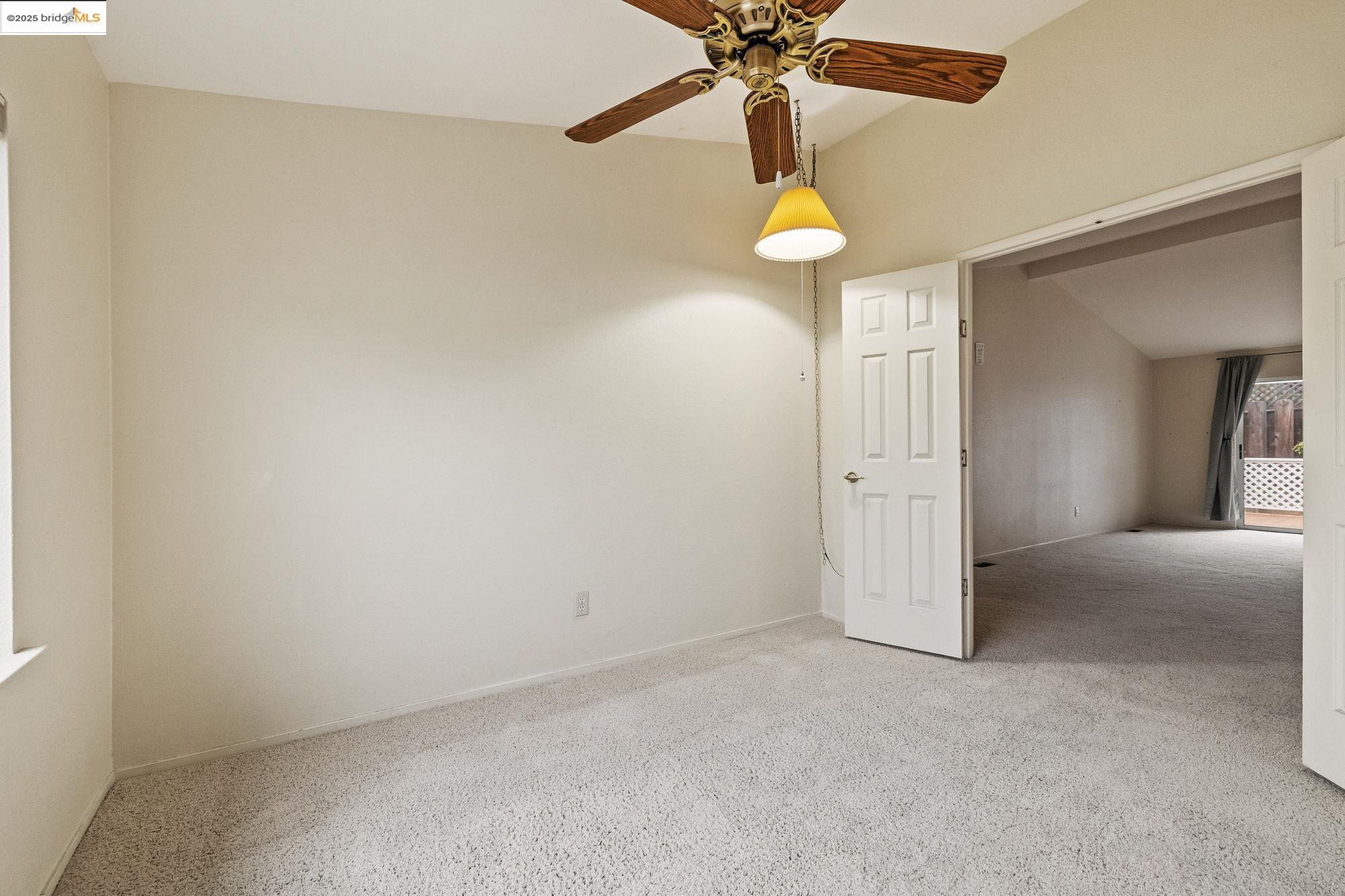19560 River Birch Court, Unit 1 Sonora, CA 95370 - Photo 16 of 38 an empty room with a fan and a fan