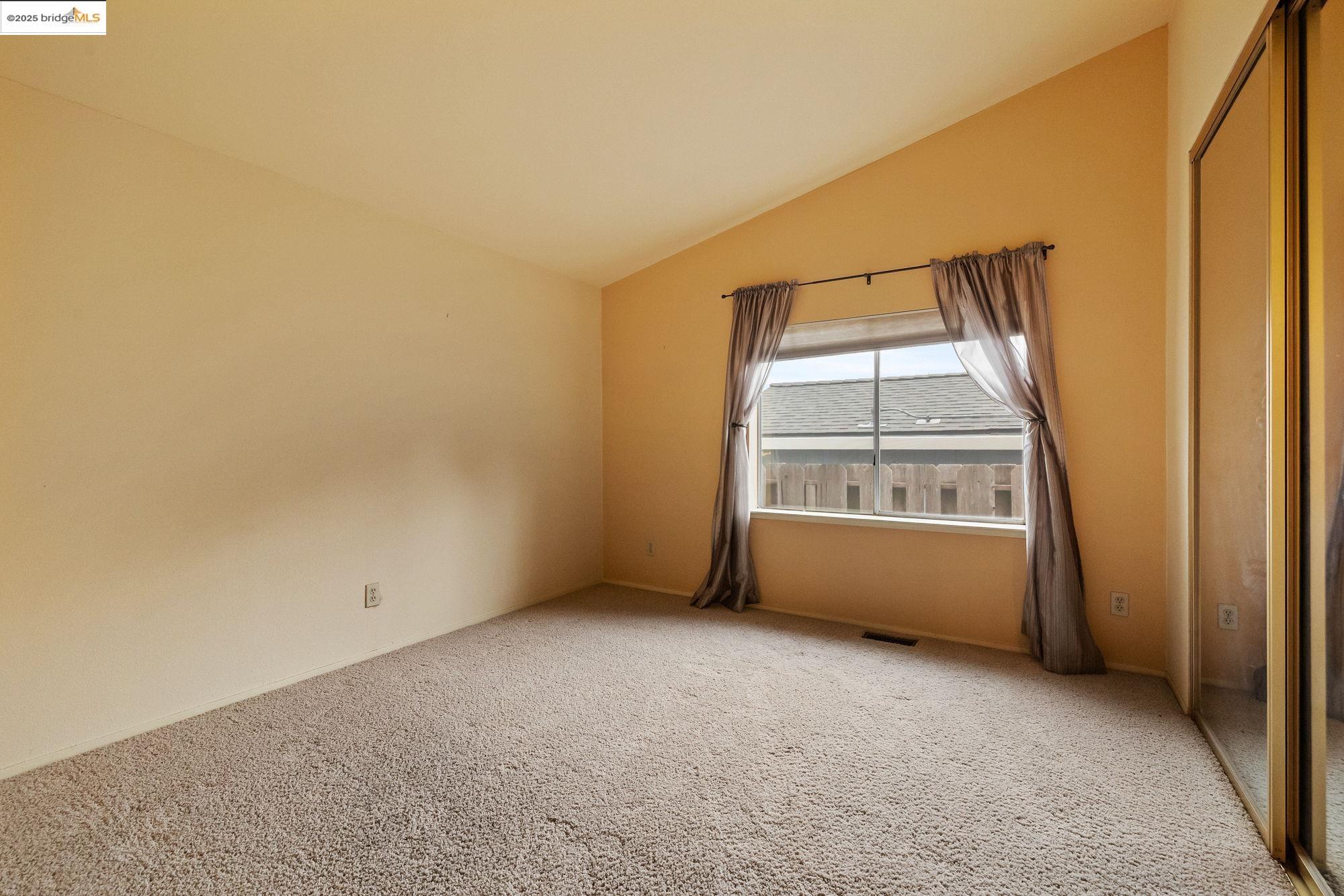 19560 River Birch Court, Unit 1 Sonora, CA 95370 - Photo 22 of 38 an empty room with a empty space and a window