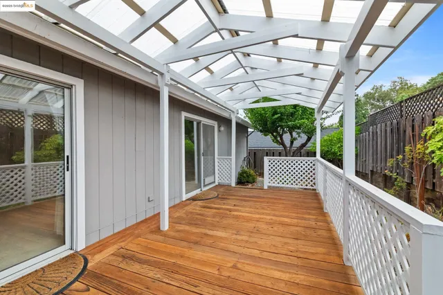 a view of a balcony with furniture