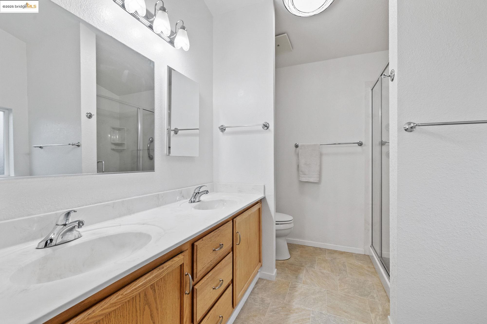 19560 River Birch Court, Unit 1 Sonora, CA 95370 - Photo 27 of 38 a bathroom with a sink a vanity and a mirror