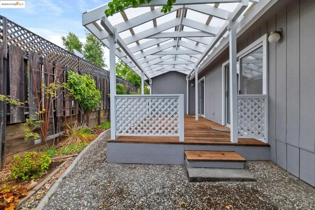 a view of outdoor space with deck and living area