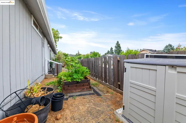 a view of a backyard with furniture