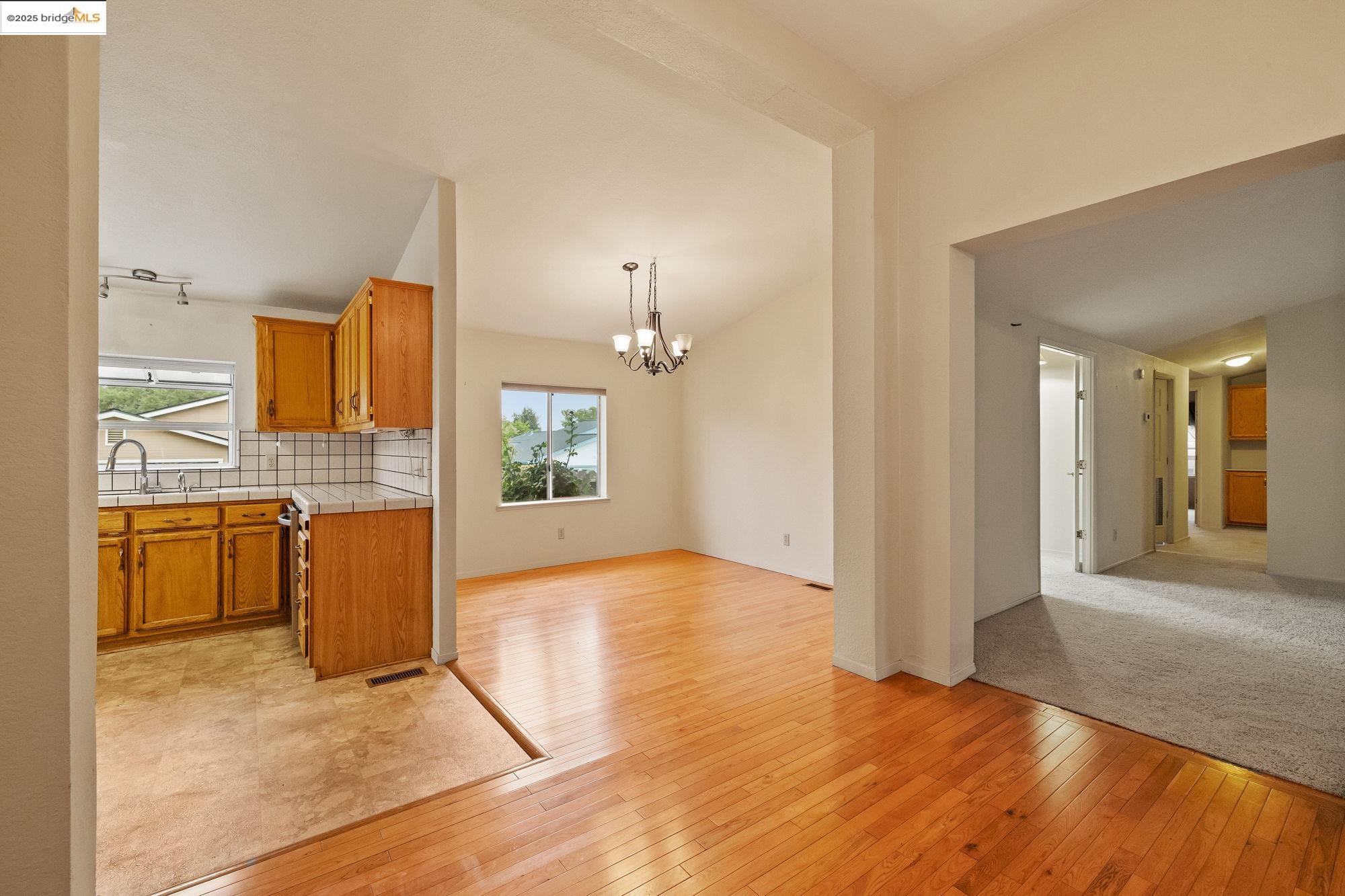 19560 River Birch Court, Unit 1 Sonora, CA 95370 - Photo 6 of 38 a view of a kitchen with a sink and a refrigerator