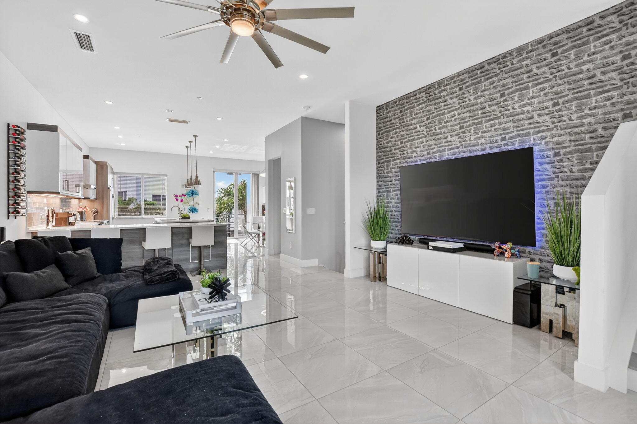 4021 Northwest 18th Way Boca Raton, FL 33431 - Photo 19 of 37 a living room with furniture and a flat screen tv