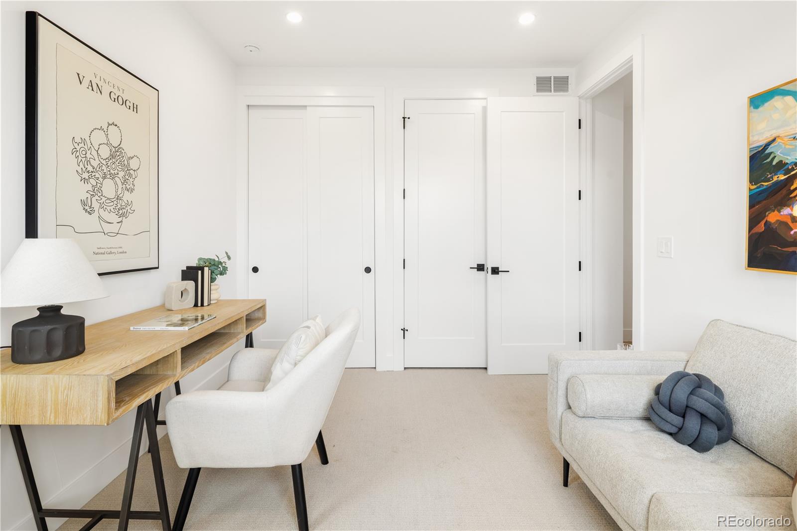 1205 Utica Street Denver, CO 80204 - Photo 15 of 35 a living room with furniture and a painting