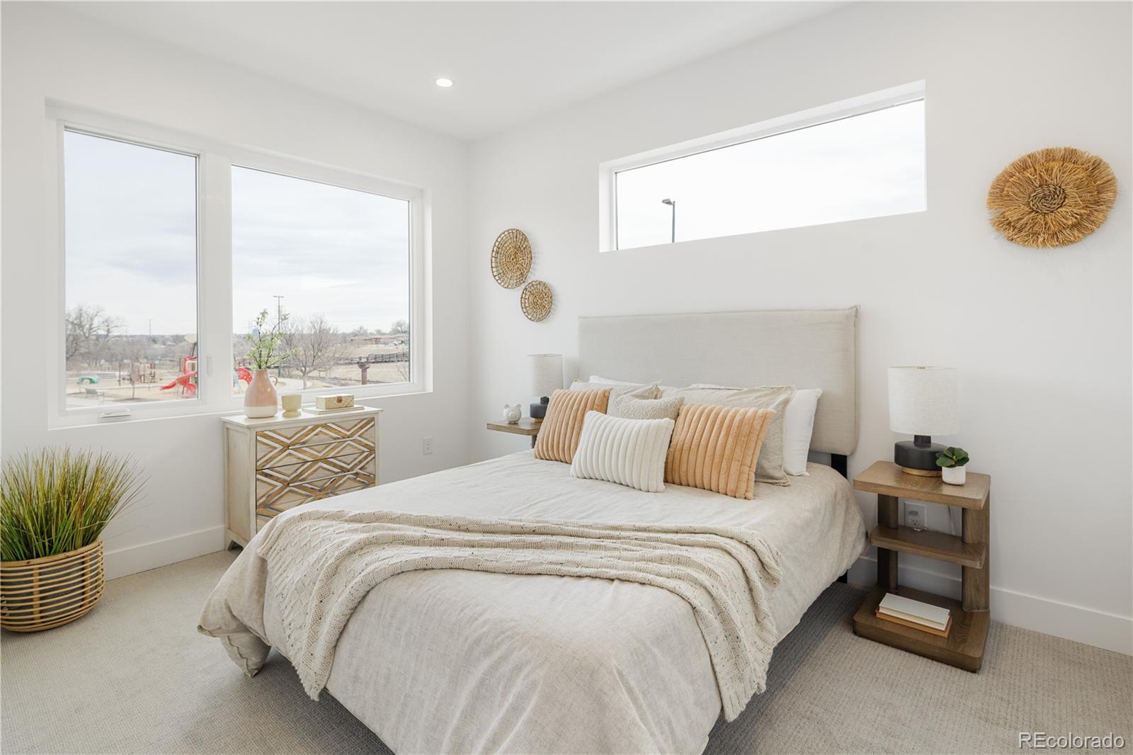 1205 Utica Street Denver, CO 80204 - Photo 17 of 35 a bedroom with a bed and a large window