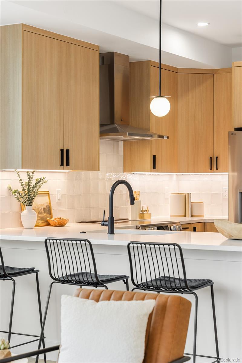 1205 Utica Street Denver, CO 80204 - Photo 28 of 35 a living room with a couch and a table