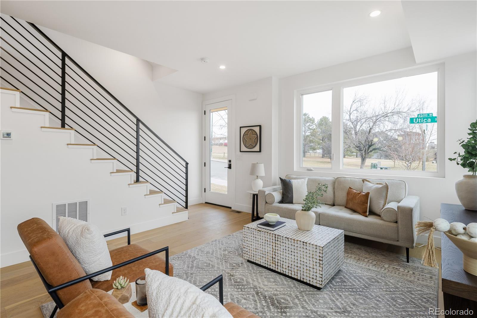 1205 Utica Street Denver, CO 80204 - Photo 7 of 35 a living room with furniture or couch and a large window