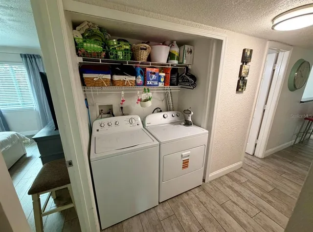 a bedroom with bed and walk in closet