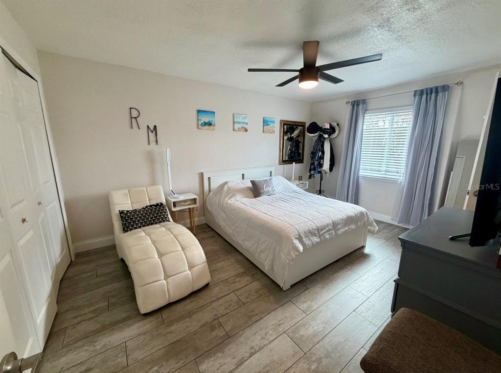 1938 South Conway Road, Unit 7 Orlando, FL 32812 - Photo 13 of 23 a bedroom with bed and walk in closet