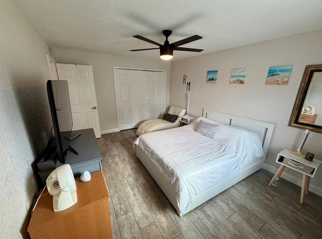 1938 South Conway Road, Unit 7 Orlando, FL 32812 - Photo 14 of 23 a bedroom with a bed and a flat screen tv