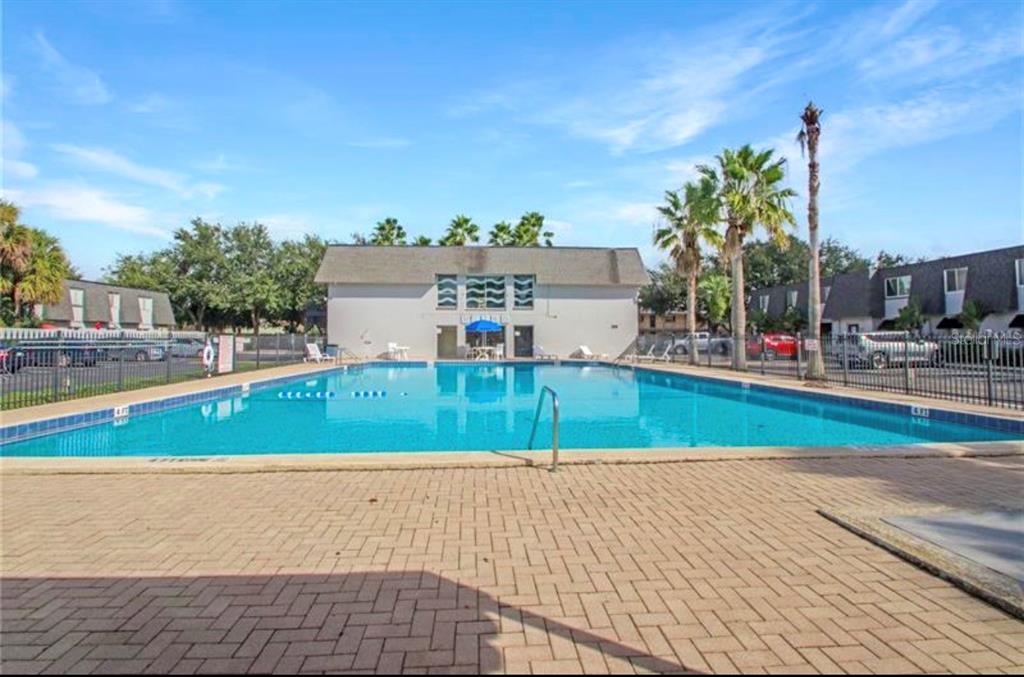 1938 South Conway Road, Unit 7 Orlando, FL 32812 - Photo 22 of 23 a view of outdoor space yard and swimming pool