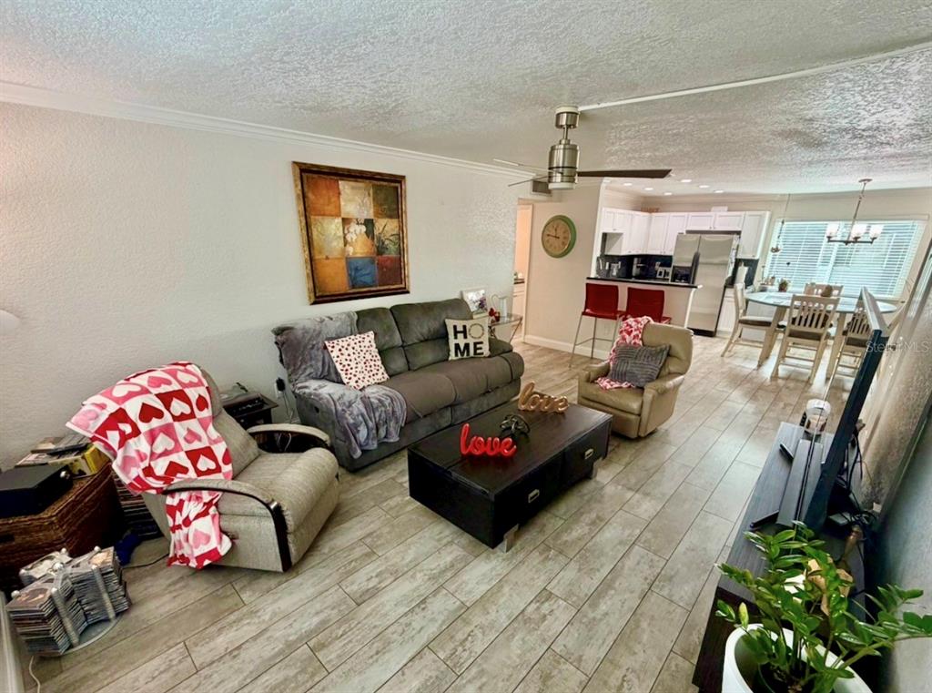 1938 South Conway Road, Unit 7 Orlando, FL 32812 - Photo 4 of 23 a living room with furniture and a flat screen tv
