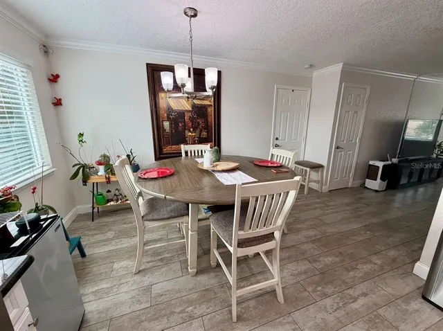 a view of a dining room with furniture