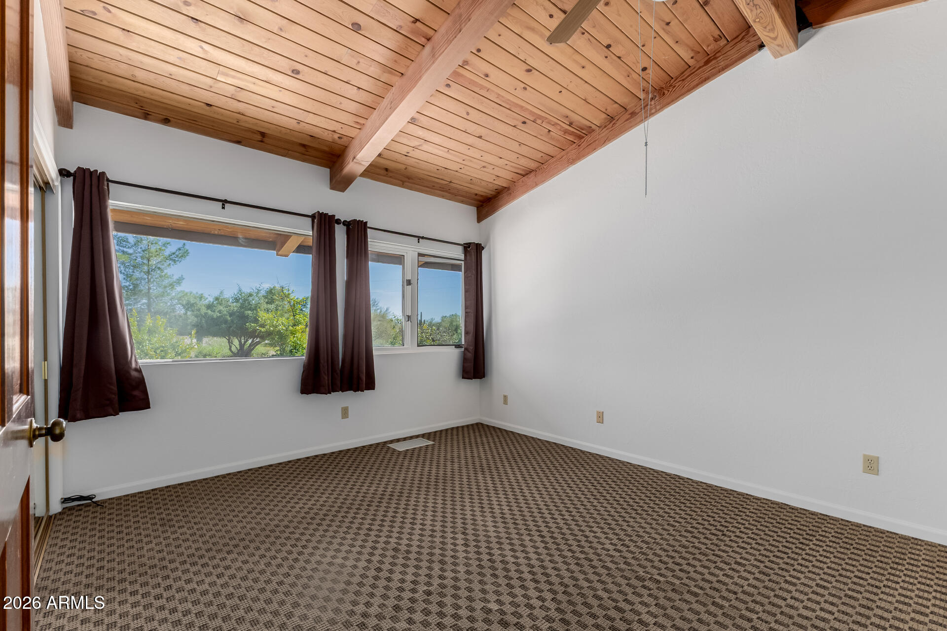 6140 East Peak View Road Cave Creek, AZ 85331 - Photo 20 of 52 a view of an empty room with a window