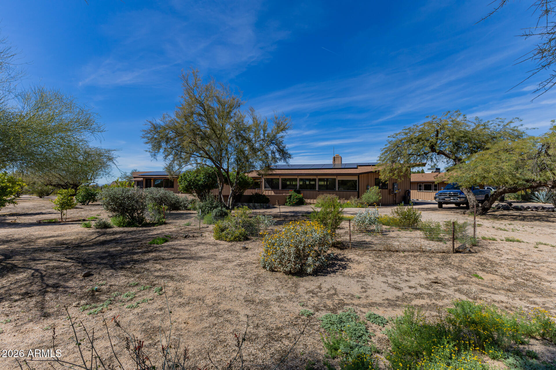 6140 East Peak View Road Cave Creek, AZ 85331 - Photo 2 of 52 a front view of a house with a yard