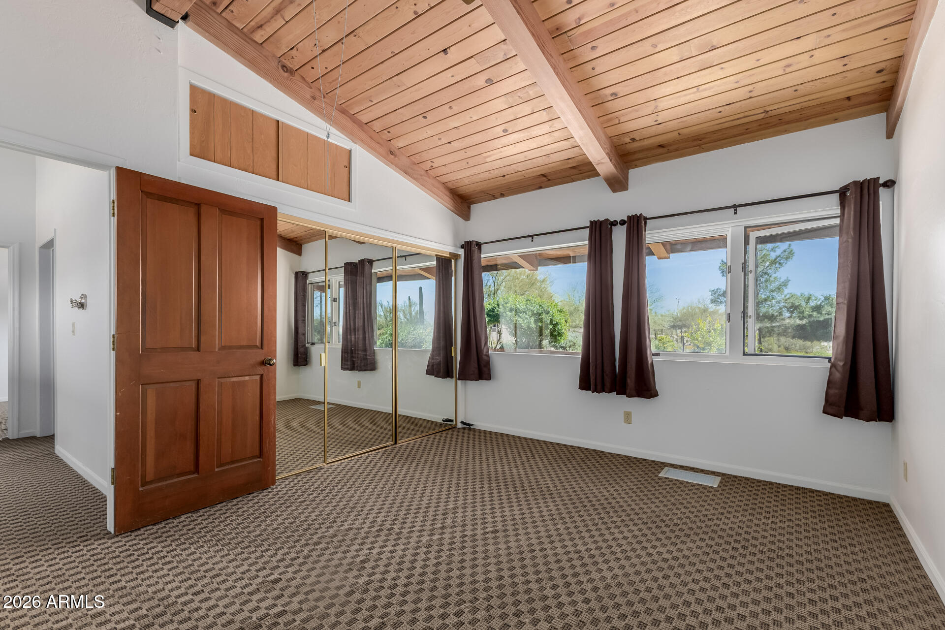6140 East Peak View Road Cave Creek, AZ 85331 - Photo 21 of 52 a hallway with a large window and walk in closet