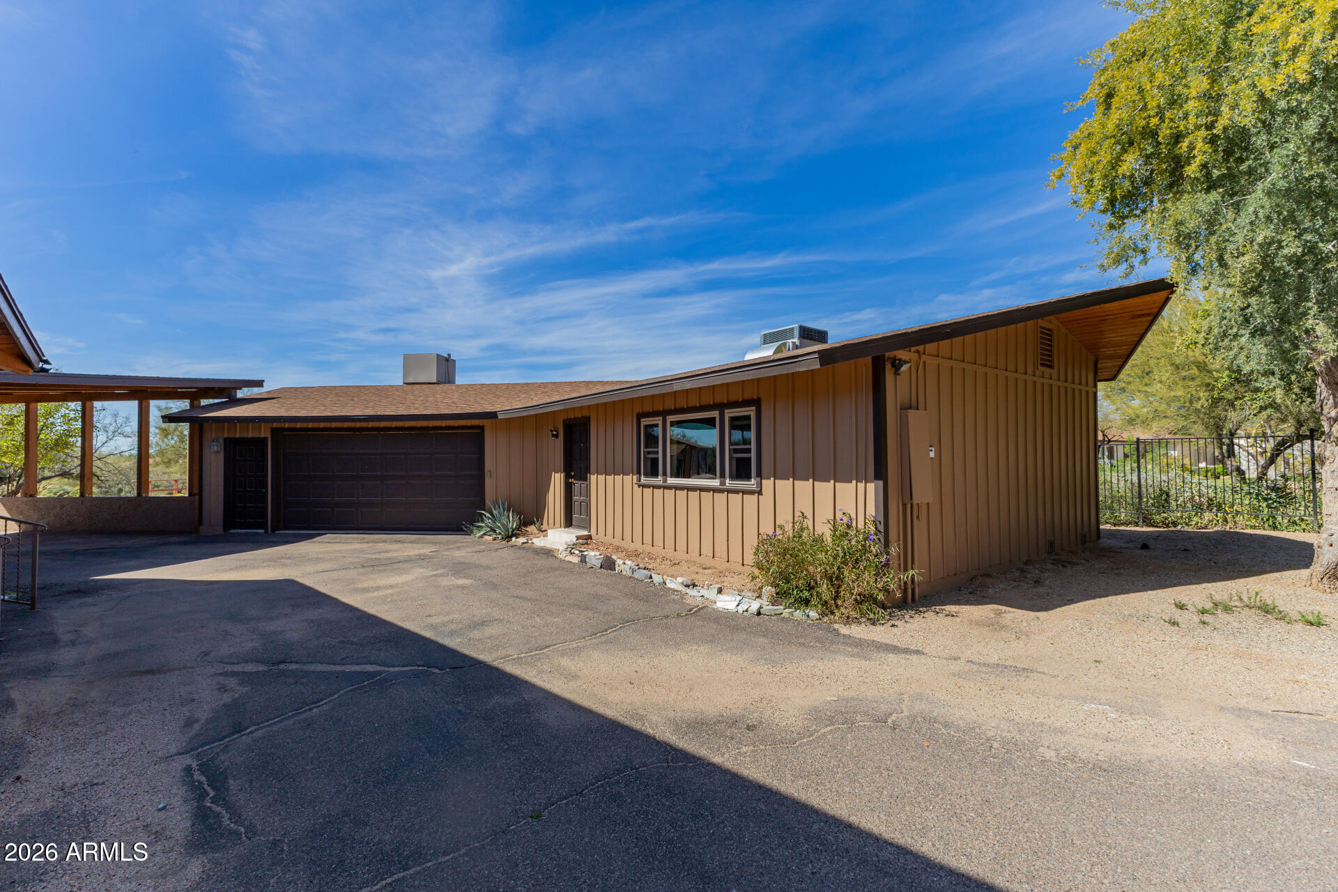 6140 East Peak View Road Cave Creek, AZ 85331 - Photo 23 of 52 a front view of a house having yard
