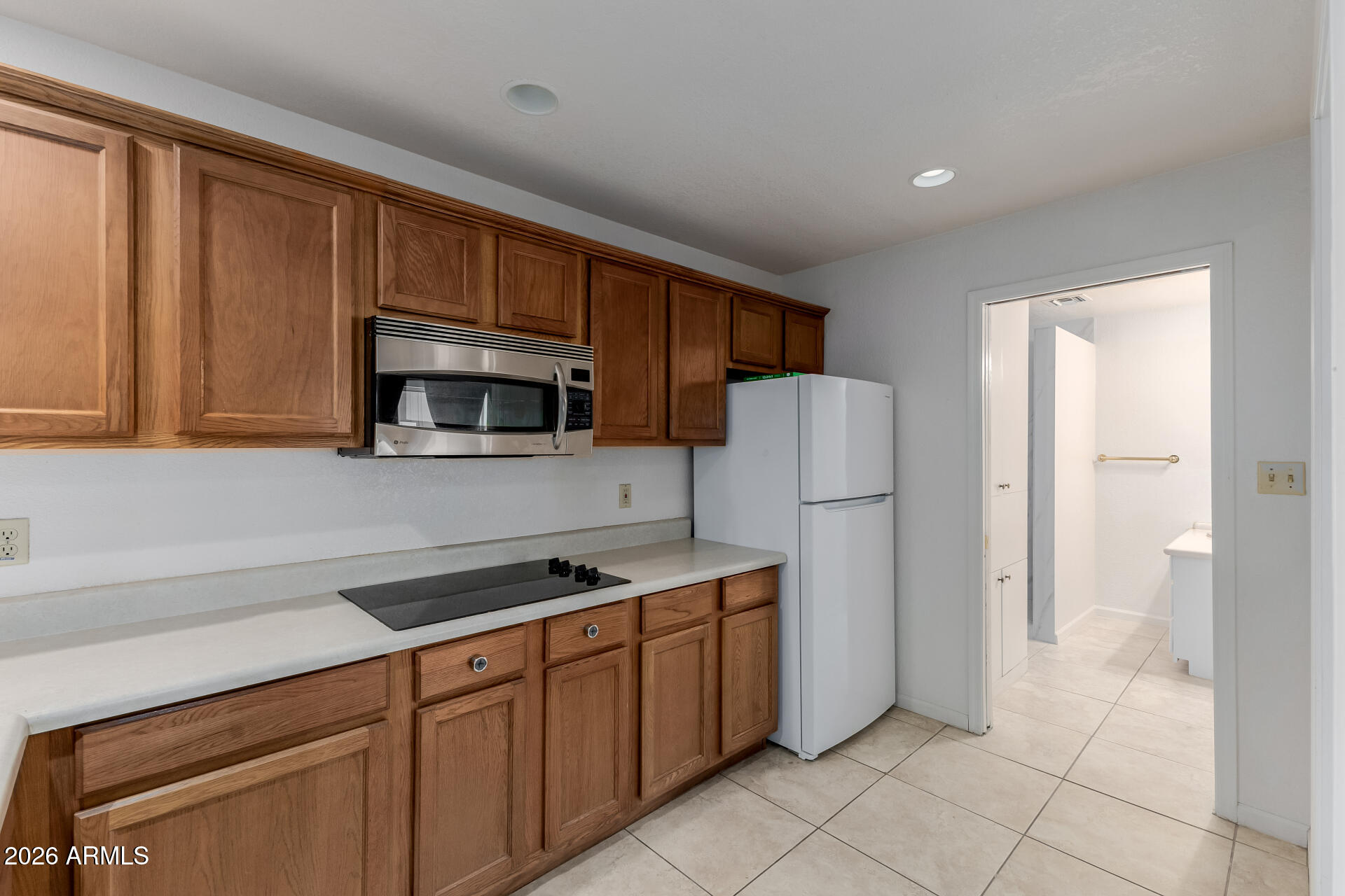 6140 East Peak View Road Cave Creek, AZ 85331 - Photo 29 of 52 a kitchen with stainless steel appliances granite countertop a refrigerator stove and sink