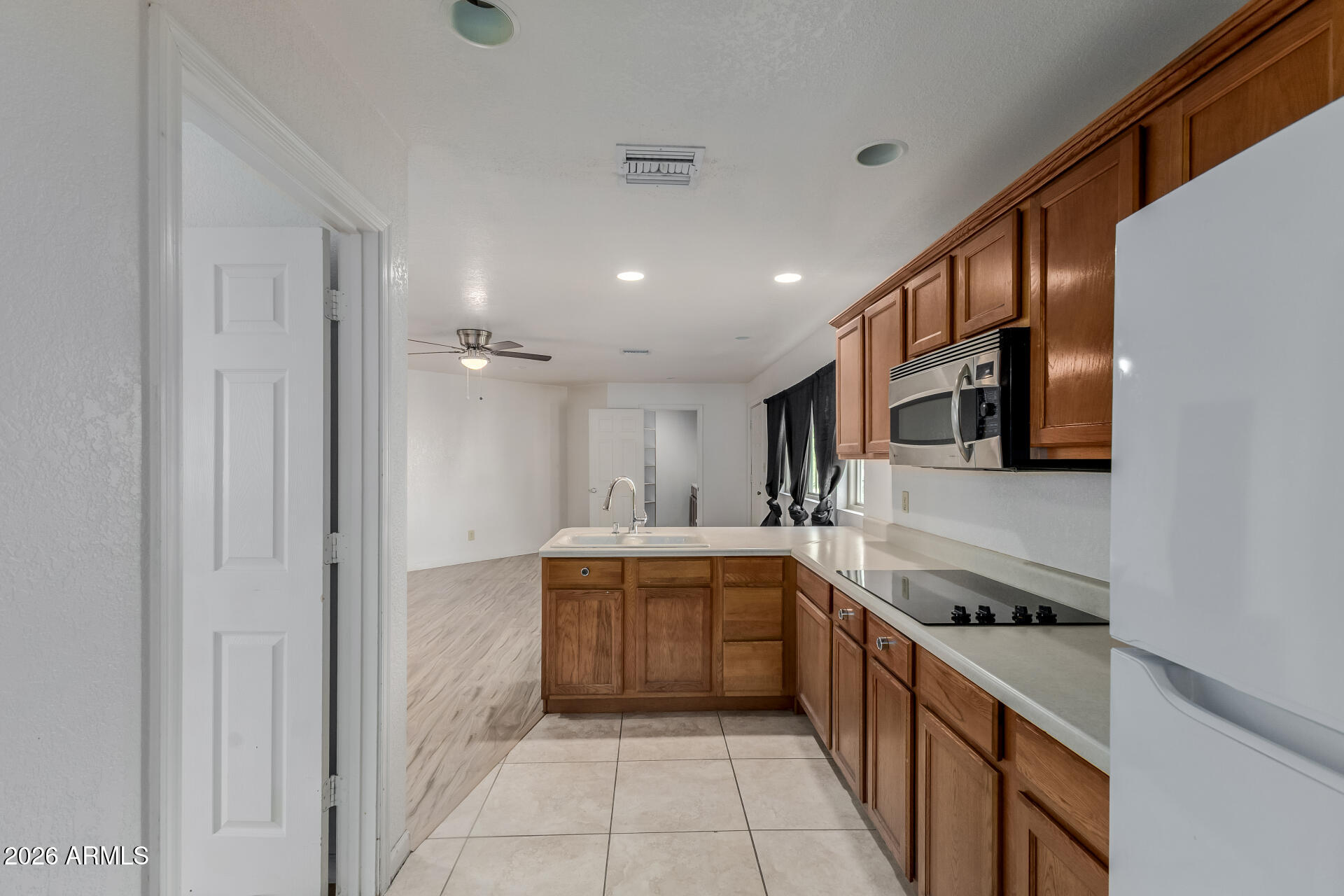6140 East Peak View Road Cave Creek, AZ 85331 - Photo 30 of 52 a large kitchen with a sink and cabinets