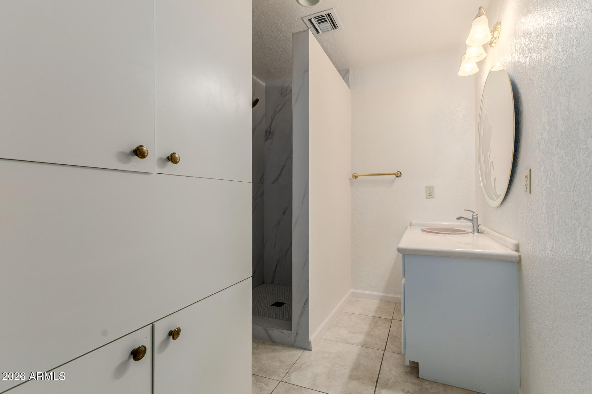 6140 East Peak View Road Cave Creek, AZ 85331 - Photo 34 of 52 a bathroom with a sink and mirror