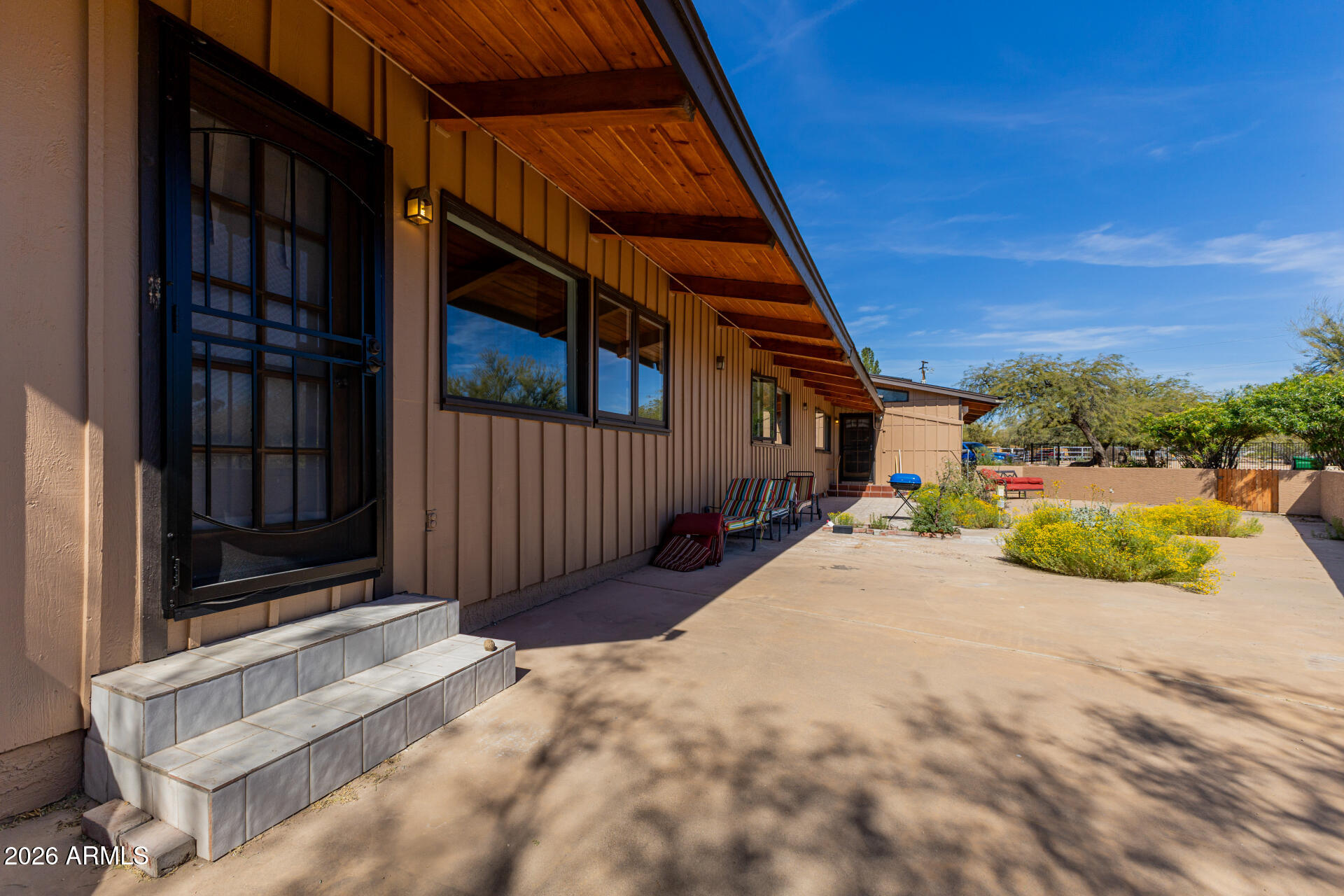 6140 East Peak View Road Cave Creek, AZ 85331 - Photo 37 of 52 a view of a house with backyard and porch