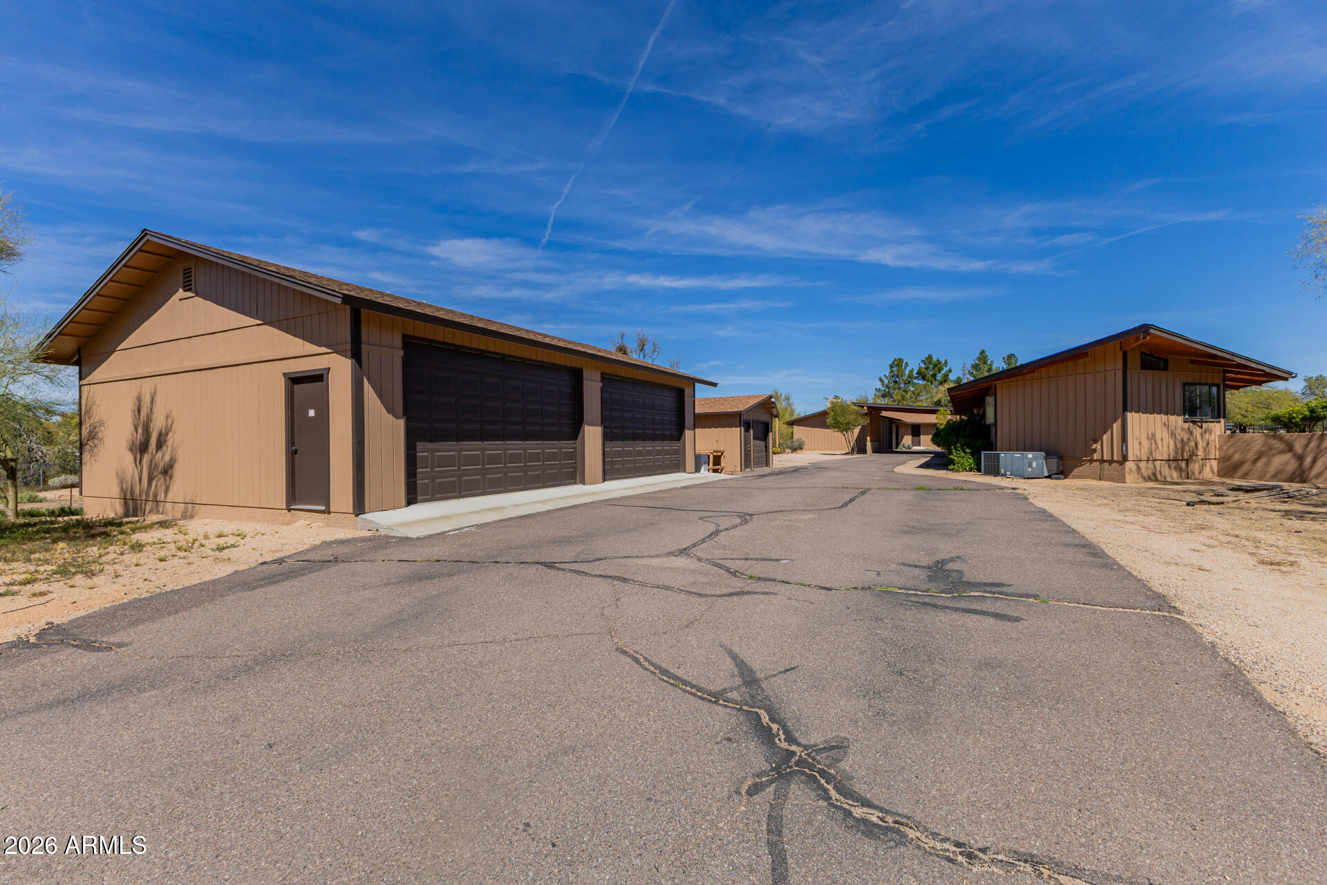 6140 East Peak View Road Cave Creek, AZ 85331 - Photo 44 of 52 a view of garage with a wooden fence