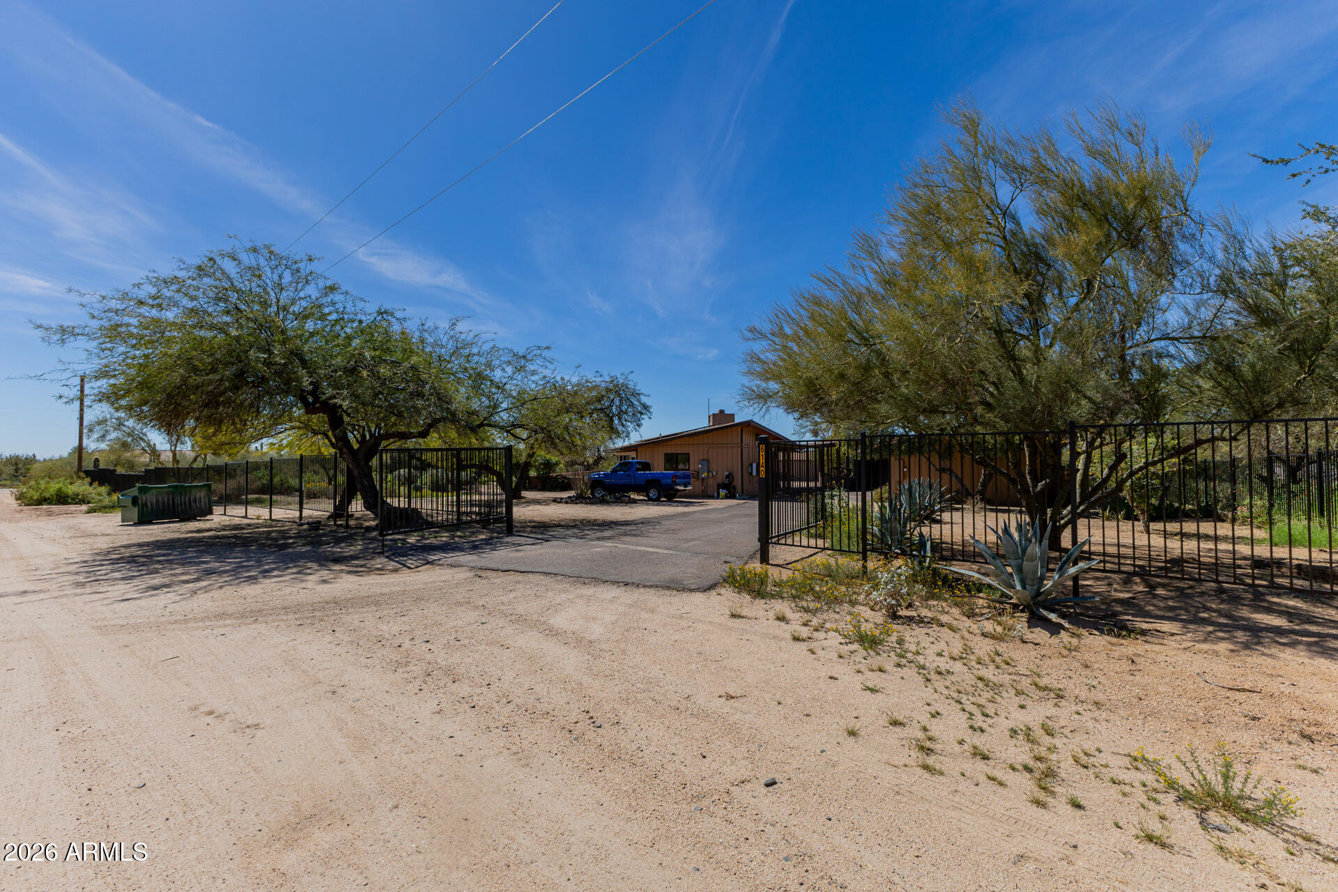 6140 East Peak View Road Cave Creek, AZ 85331 - Photo 47 of 52 a view of a yard with a table and chairs