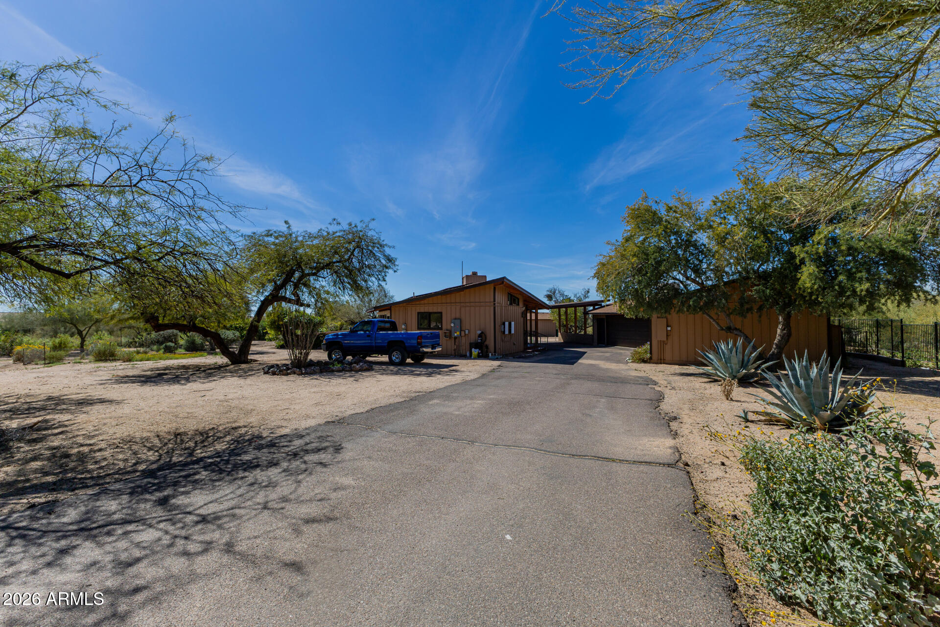 6140 East Peak View Road Cave Creek, AZ 85331 - Photo 48 of 52 a view of car parked in front of house
