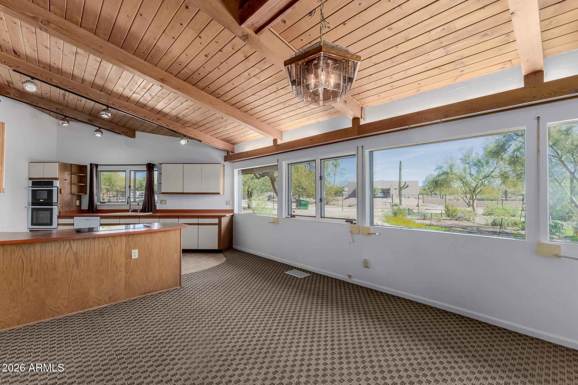 6140 East Peak View Road Cave Creek, AZ 85331 - Photo 6 of 52 a kitchen with stainless steel appliances granite countertop a sink and cabinets