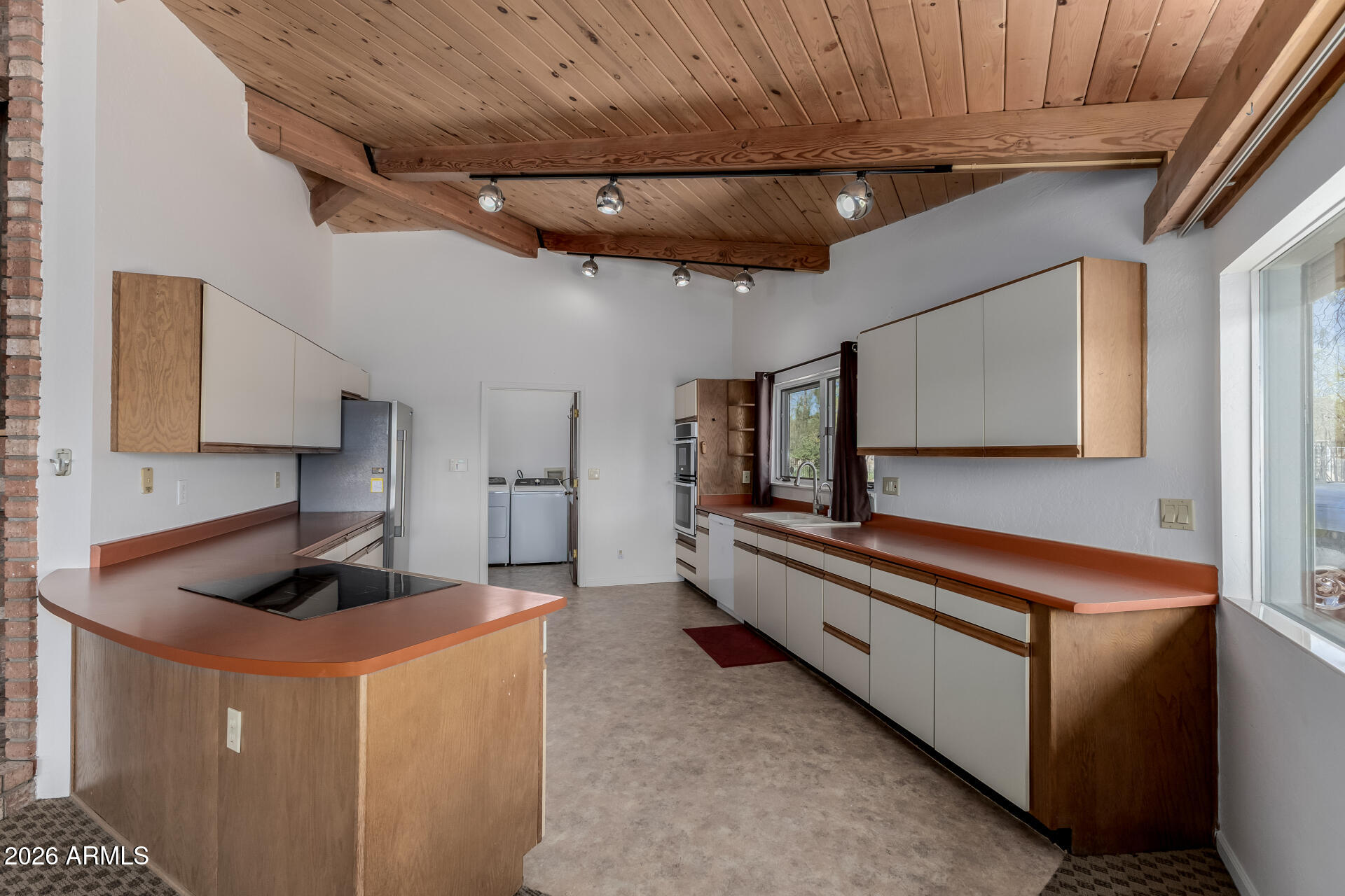 6140 East Peak View Road Cave Creek, AZ 85331 - Photo 7 of 52 a kitchen with stainless steel appliances granite countertop a sink a stove and a refrigerator