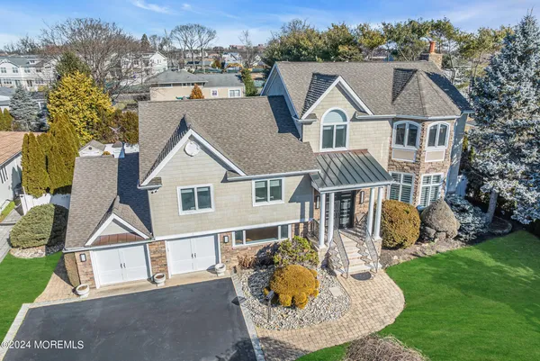 an aerial view of a residential houses with outdoor space