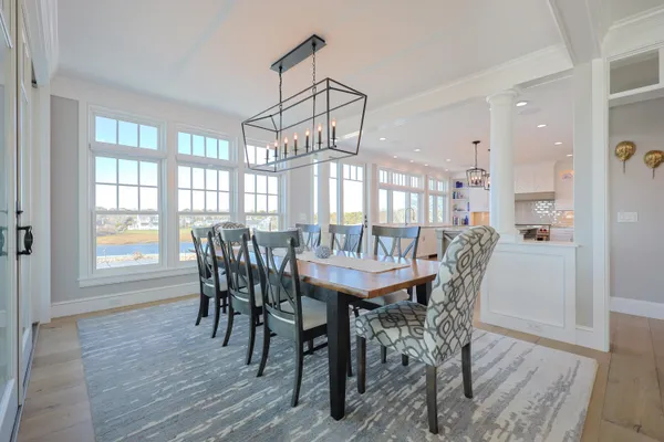 a kitchen with stainless steel appliances granite countertop a refrigerator a oven and a sink with granite countertops