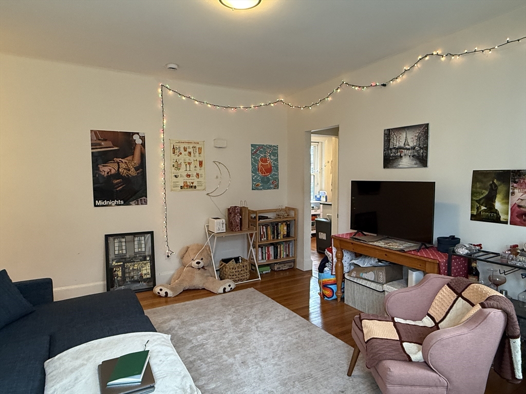 1871 Beacon Street, Unit 4 Brookline, MA 02445 - Photo 13 of 14 a living room with furniture and a flat screen tv