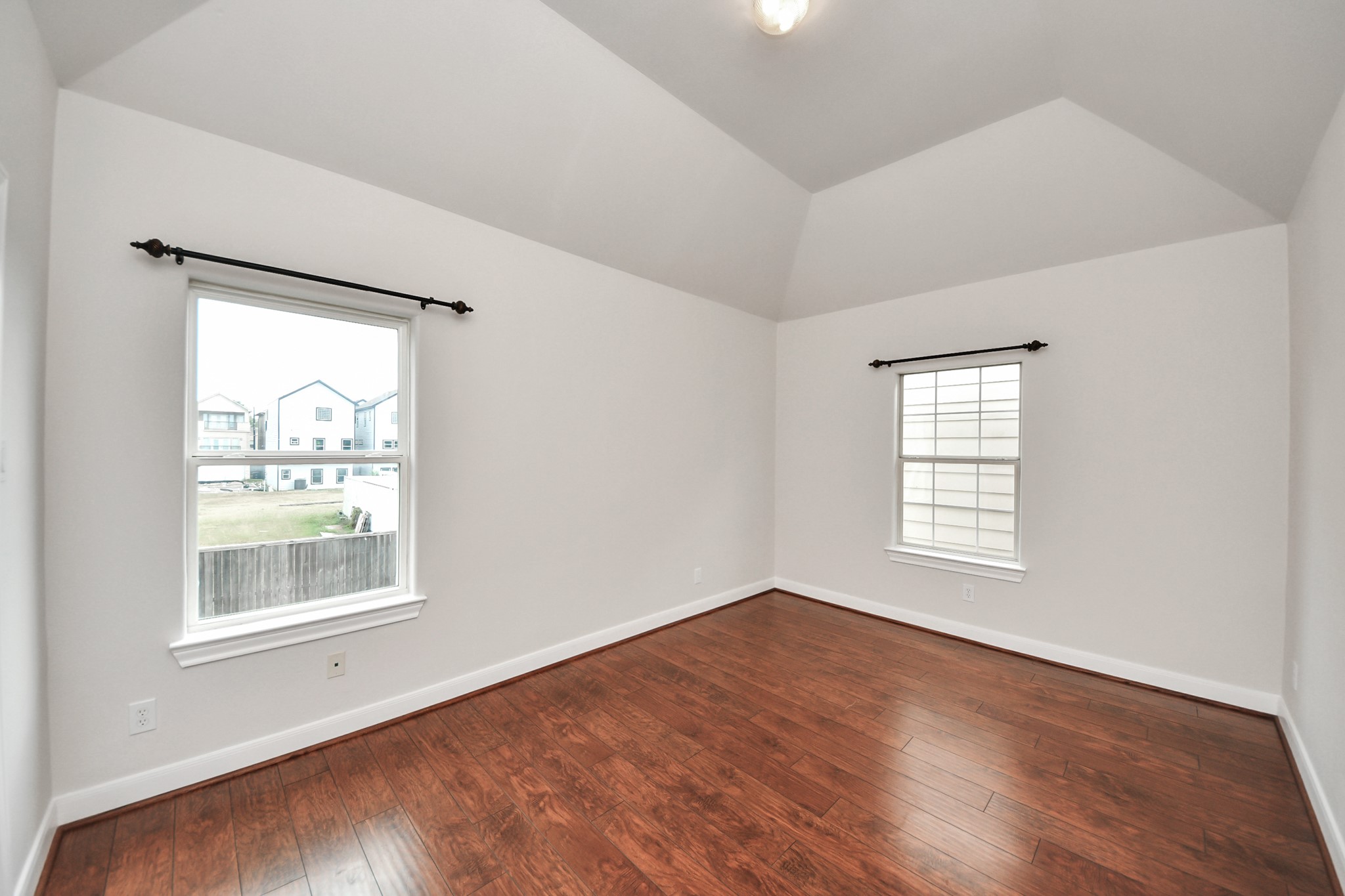 2941 Clinton Drive Houston, TX 77020 - Photo 13 of 35 a view of an empty room with wooden floor and a window