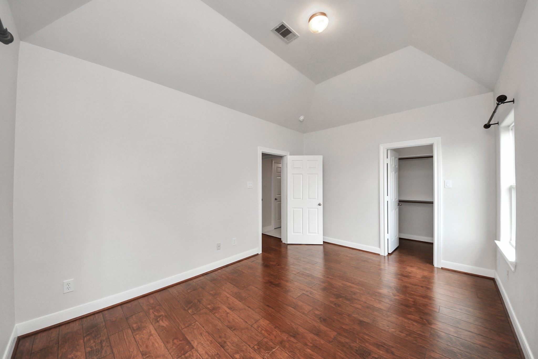 2941 Clinton Drive Houston, TX 77020 - Photo 14 of 35 a view of an empty room with wooden floor and a window