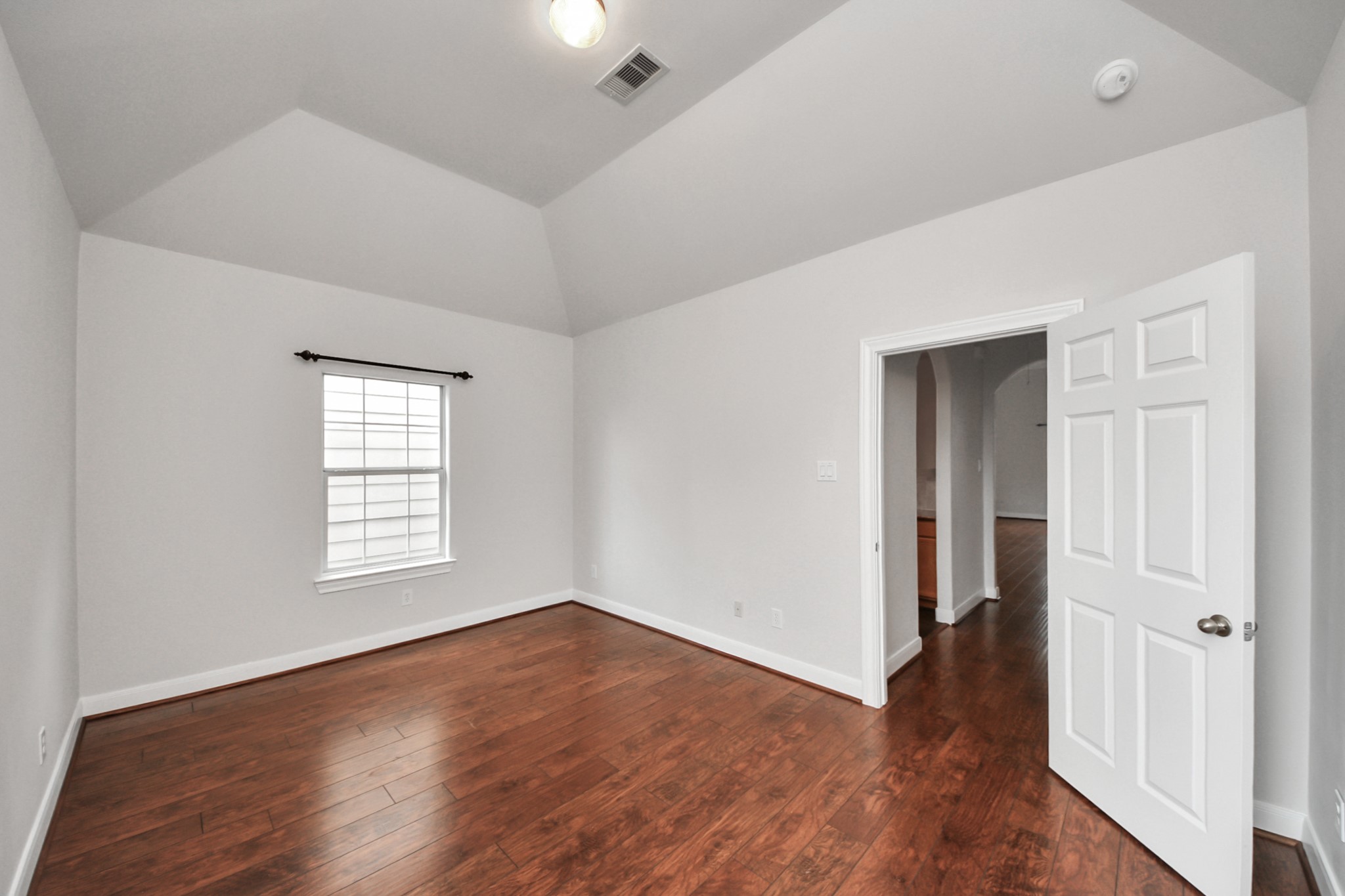 2941 Clinton Drive Houston, TX 77020 - Photo 15 of 35 an empty room with wooden floor and windows