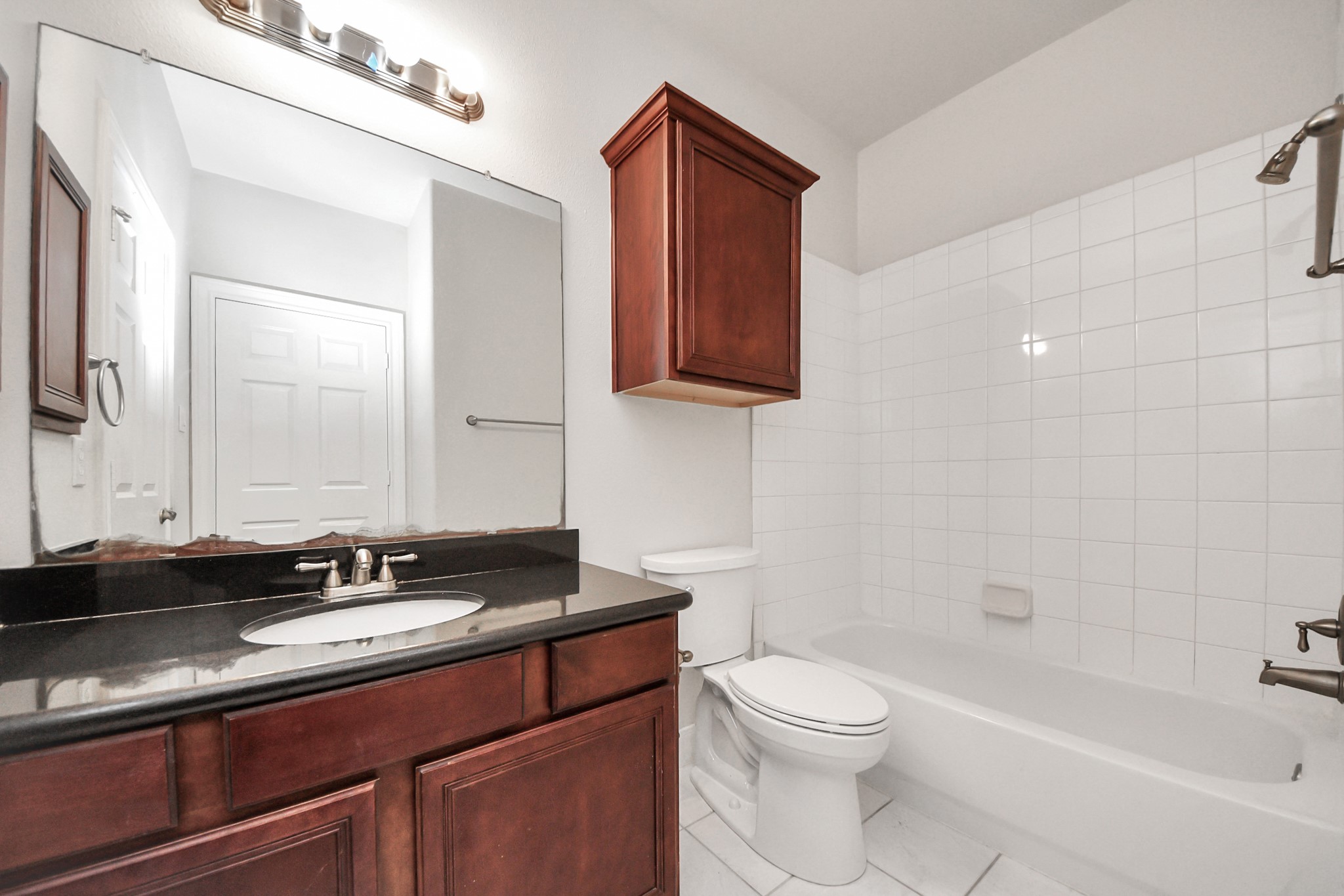 2941 Clinton Drive Houston, TX 77020 - Photo 16 of 35 a bathroom with a granite countertop sink a toilet and bathtub