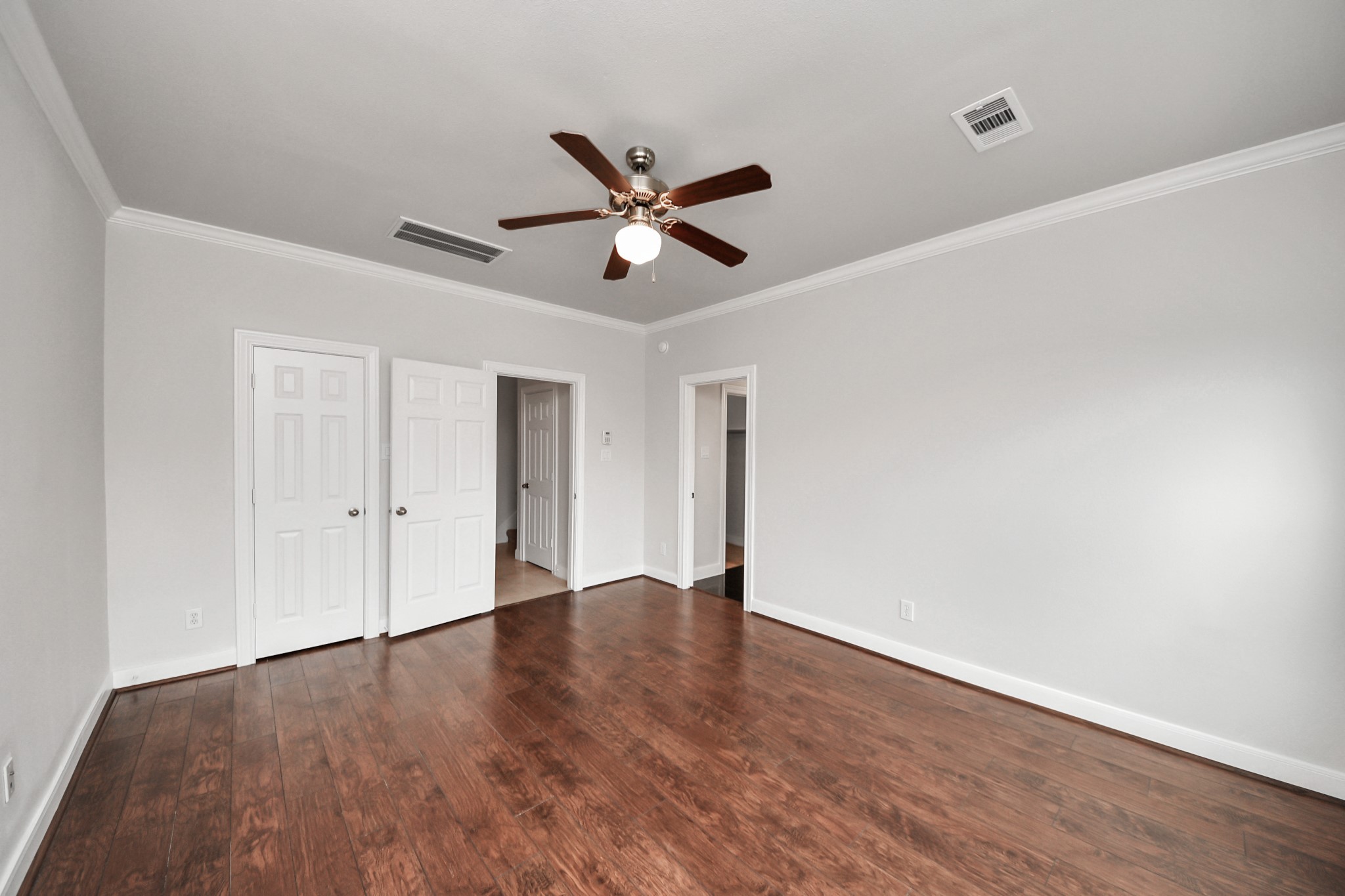 2941 Clinton Drive Houston, TX 77020 - Photo 19 of 35 a view of an empty room with wooden floor