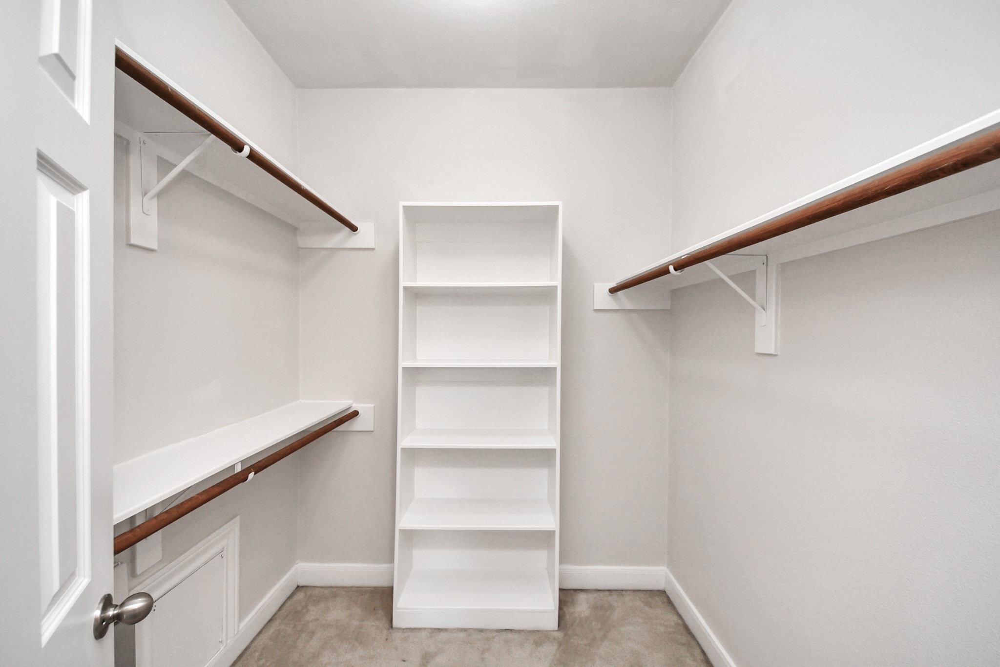 2941 Clinton Drive Houston, TX 77020 - Photo 20 of 35 a view of walk in closet with empty racks