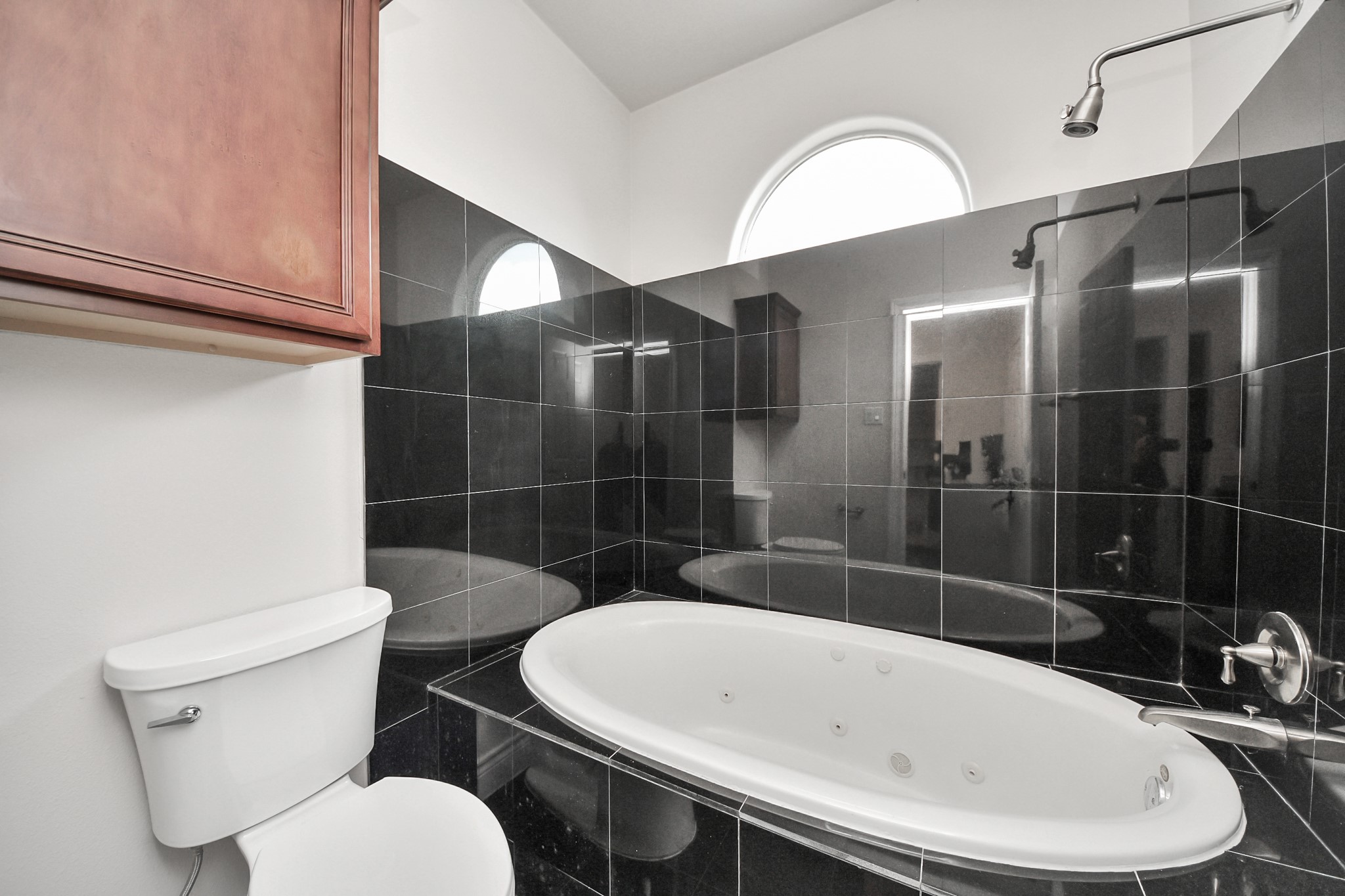 2941 Clinton Drive Houston, TX 77020 - Photo 22 of 35 a white bath tub sitting next to a white toilet