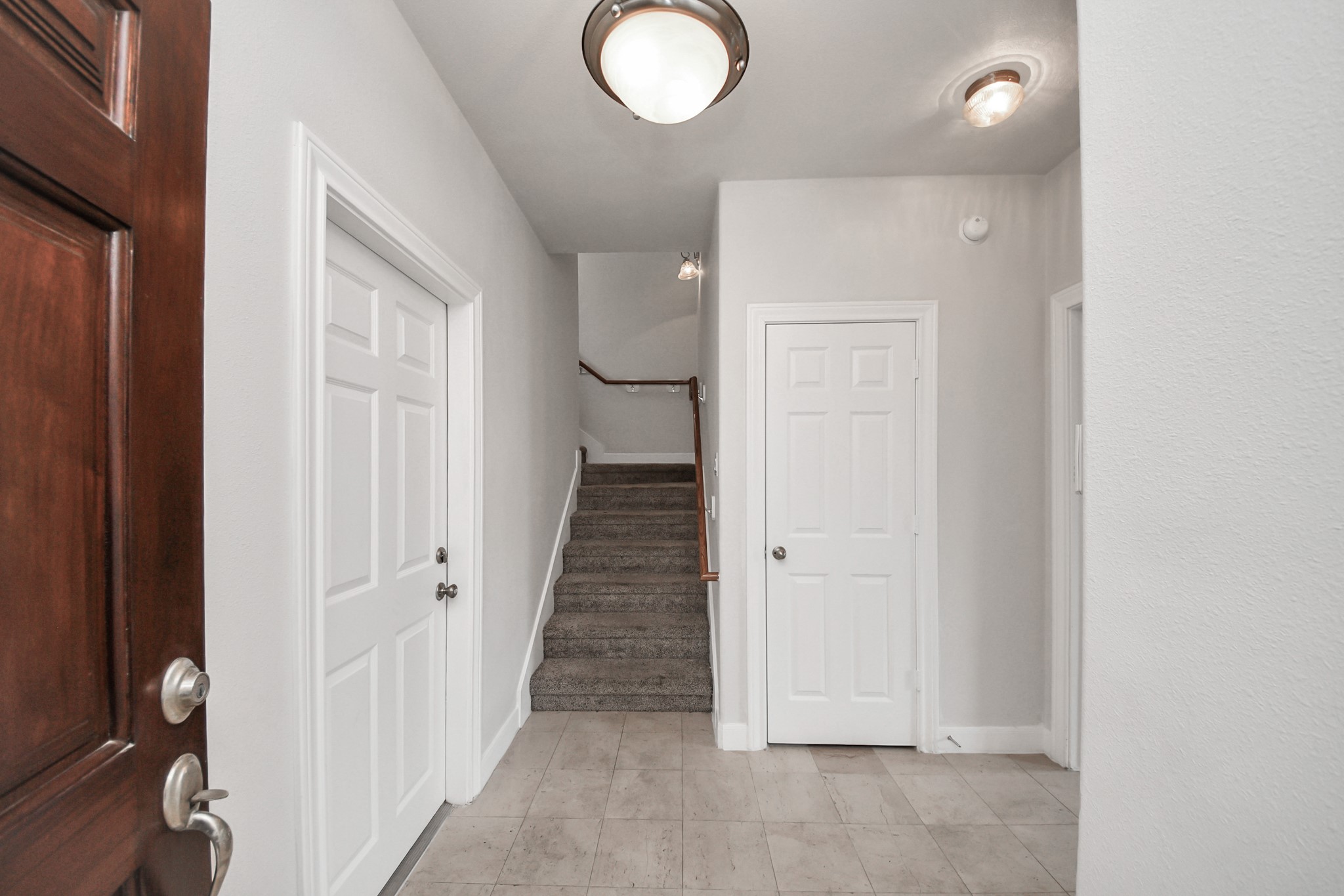 2941 Clinton Drive Houston, TX 77020 - Photo 24 of 35 a view of a hallway with wooden floor and closet
