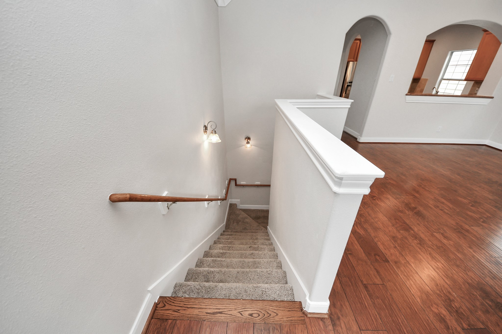 2941 Clinton Drive Houston, TX 77020 - Photo 25 of 35 a view of a livingroom with wooden floor and staircase