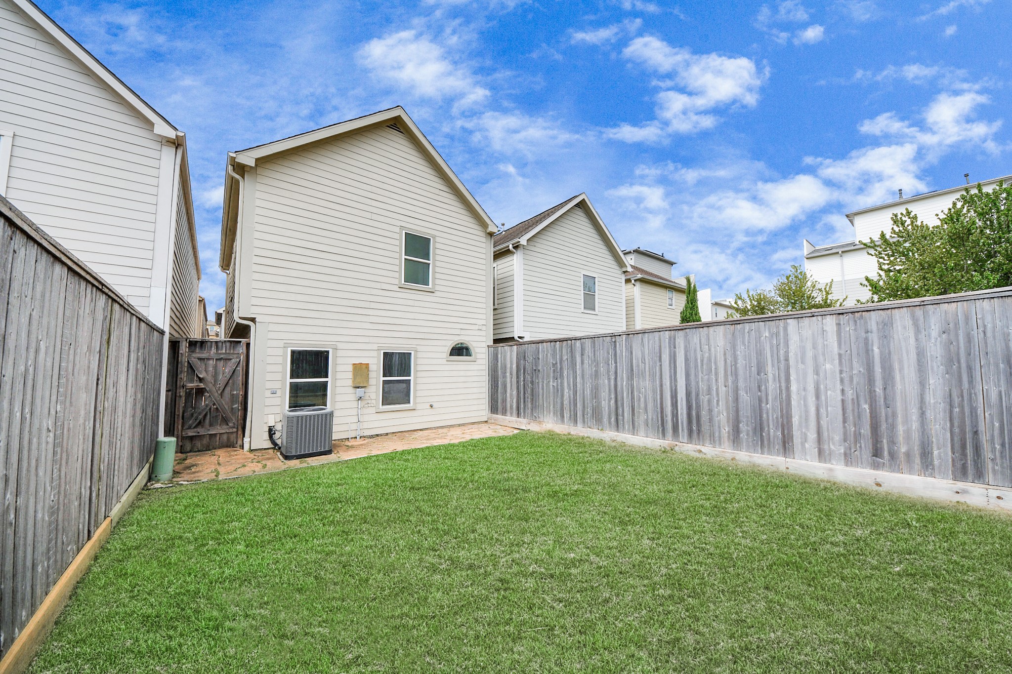 2941 Clinton Drive Houston, TX 77020 - Photo 27 of 35 a view of a house with a yard and wooden fence