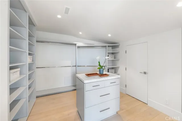 a view of a hallway with entryway windows and entryway