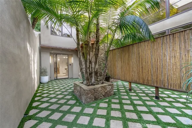 a view of a swimming pool with an outdoor space and seating area