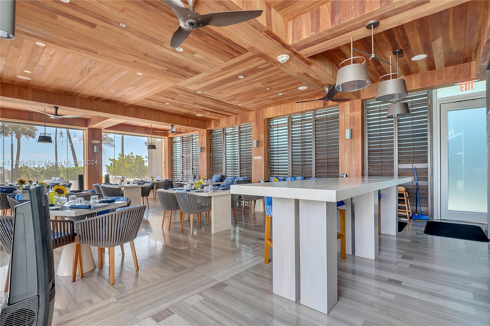 360 Ocean Drive, Unit 205S Key Biscayne, FL 33149 - Photo 24 of 27 a view of a dining room with furniture window and wooden floor