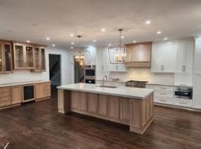 3286 Elwin Ragsdale Way Acworth, GA 30102 - Photo 15 of 51 a large kitchen with stainless steel appliances kitchen island granite countertop a stove a sink a refrigerator and white cabinets with wooden floor